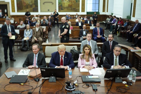 Former President Donald Trump, second from left, sits at the defense table with his attorney's Christopher Kise, left, Alina Habba, second from right, and Clifford Robert at New York Supreme Court, Thursday, Dec. 7, 2023, in New York. (AP Photo/Eduardo Munoz Alvarez, Pool)