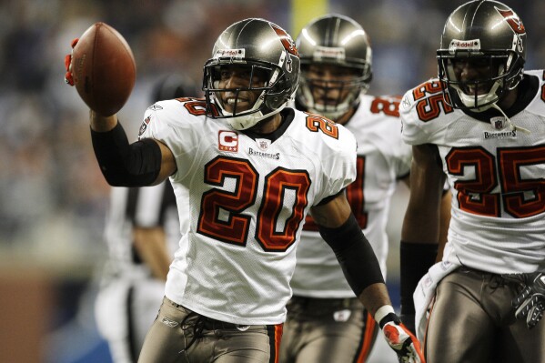 FILE - Tampa Bay Buccaneers cornerback Ronde Barber celebrates intercepting a pas by Detroit Lions' Daunte Culpepper in the second quarter of an NFL football game in Detroit, Nov. 23, 2008. Barber never doubted he’d wind up in the Pro Football Hall of Fame. The undersized cornerback’s journey included some of the most memorable plays in Tampa Bay Buccaneers history, as well as five trips to Canton in which he resisted the temptation to step foot in the building where he’ll be enshrined as part of a class of nine 2023 inductees. (AP Photo/Paul Sancya, File)