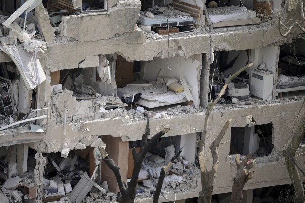 Shattered rooms are seen in an apartment building at the site of a direct missile strike launched from Iran in Tel Aviv, Israel, Sunday, June 22, 2025. (AP Photo/Oded Balilty