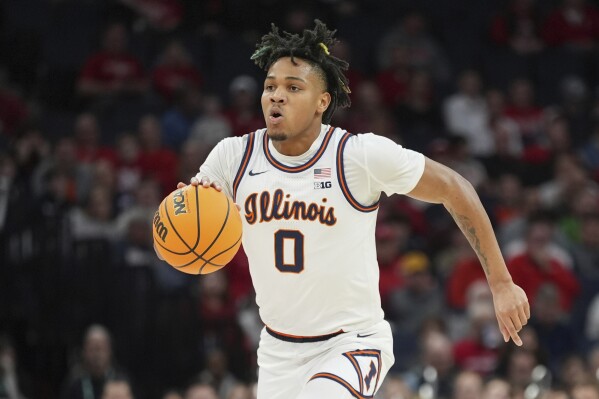 Illinois guard Terrence Shannon Jr. (0) dribbles down the court during the first half of an NCAA college basketball game against Nebraska in the semifinal round of the Big Ten Conference tournament, Saturday, March 16, 2024, in Minneapolis. (AP Photo/Abbie Parr)