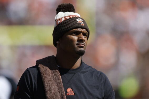 Cleveland Browns quarterback Deshaun Watson stands on the sideline during the first half of an NFL football game against the Baltimore Ravens, Sunday, Oct. 1, 2023, in Cleveland. (AP Photo/Ron Schwane)
