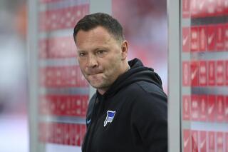 Hertha coach Pal Dardai reacts after the German Bundesliga soccer match between RB Leipzig and Hertha BSC Berlin in Leipzig, Germany, Saturday, Sept. 25, 2021. Hertha Berlin backer Lars Windhorst losing patience with lack of progress.It was the second successive heavy defeat Hertha suffered against one of the teams Windhorst wants to challenge as part of his vision of turning Hertha into one of Germany’s best. (Robert Michael/dpa via AP)