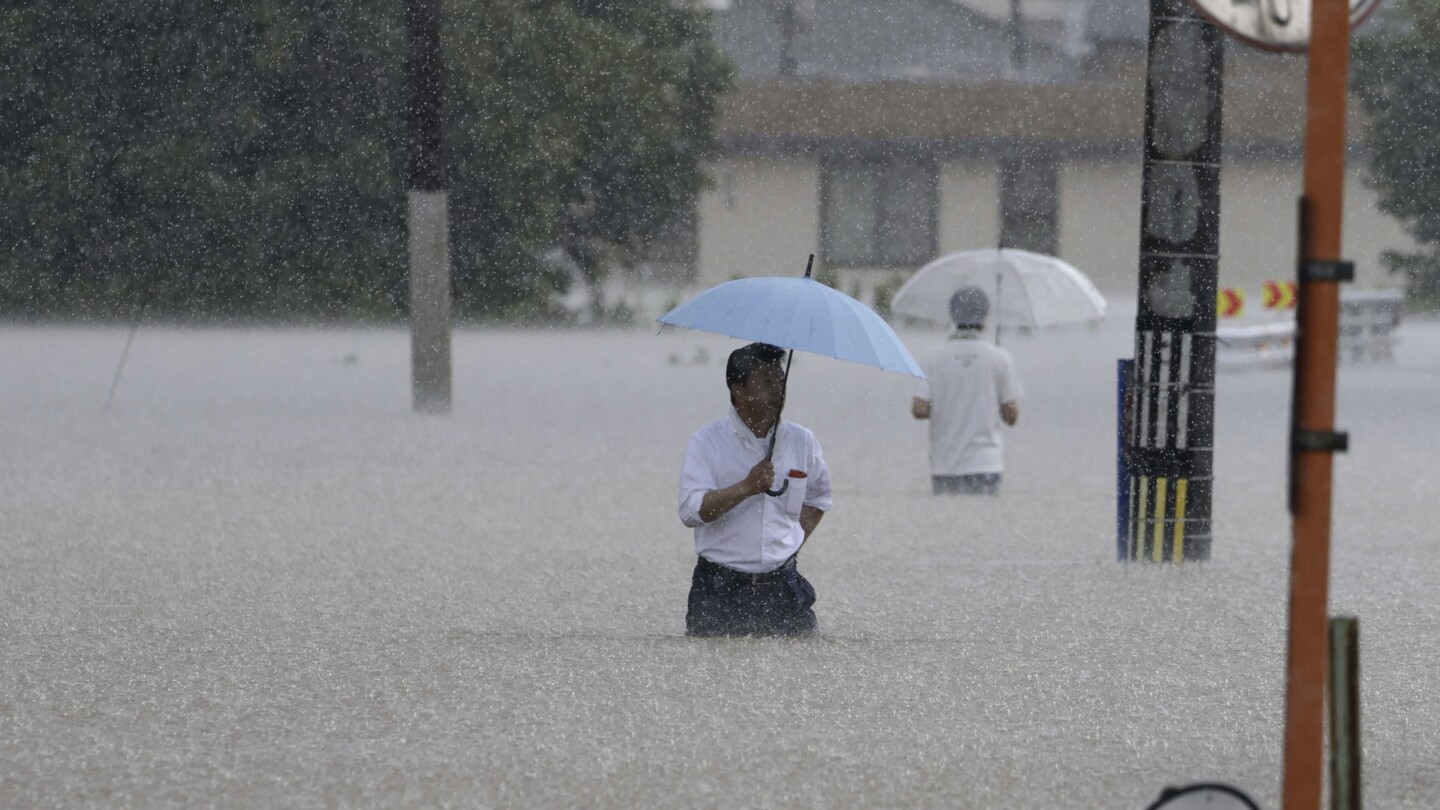 people walking in the rain