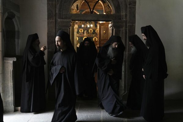 Father Isaiah leaves after dinner at the Simonopetra, or Simonos Petra Monastery, home of the all-male autonomous community of Agion Oros, or Holy Mountain, on the peninsula of Mount Athos in northern Greece, April 14, 2025. (AP Photo/Thanassis Stavrakis)