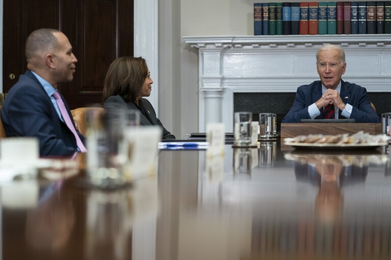 FILE - House Minority Leader Hakeem Jeffries of N.Y., left, and Vice President Kamala Harris listen as President Joe Biden speaks during a meeting with Democratic lawmakers in the Roosevelt Room of the White House, Jan. 24, 2023, in Washington. AP Photo/Evan Vucci, File)