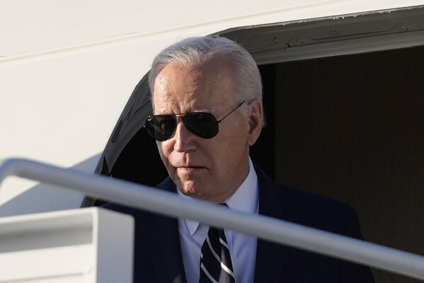 FILE - President Joe Biden arrives on Air Force One at Delaware Air National Guard Base in New Castle, Del., April 12, 2024. Tax Day reveals a major split in how Biden and former President Donald Trump would govern. The presidential candidates have conflicting ideas about how much to reveal about their own finances and the best ways to boost the economy through tax policy. Biden plans to release his tax records on Monday, April 15, 2024, which is the IRS deadline for filing. (AP Photo/Pablo Martinez Monsivais, File)