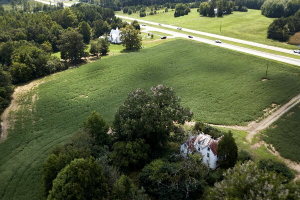 
              This Sept. 7, 2018, photo shows a farmhouse is surrounded by soybean fields in Locust Hill, Va. The U.S. and China have imposed import taxes on $50 billion worth of each other’s products. Caught in the crossfire are U.S. soybean farmers, a prime target of Beijing’s retaliatory tariffs, whose exports to China account for about 60 percent of their overseas sales. (AP Photo/Steve Helber, File)
            