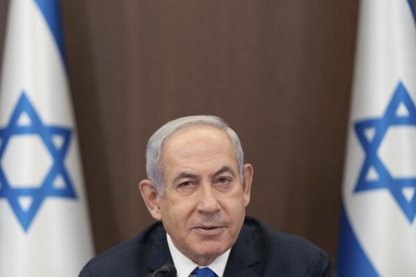 FILE - Israeli Prime Minister Benjamin Netanyahu, chairs the weekly cabinet meeting in Jerusalem, Sunday, Sept. 10, 2023. Israeli Prime Minister Benjamin Netanyahu's office says he will meet billionaire businessman Elon Musk during a trip to the United States. Netanyahu’s office declined to discuss the agenda for the meeting on Monday, Sept. 18, 2023. But it comes at a time that Musk is facing accusations of tolerating antisemitic messages on his social media platform X, formerly known as Twitter. (AP Photo/Ohad Zwigenberg, Pool, File)