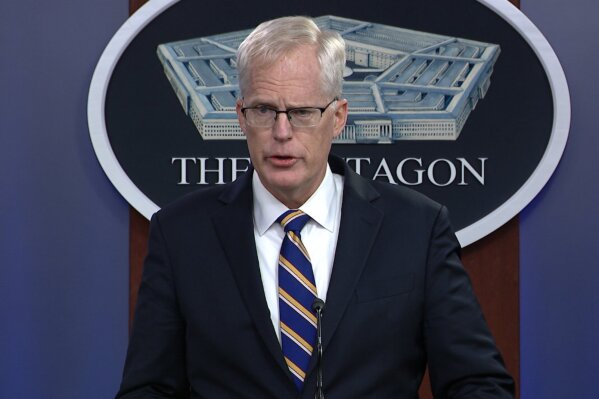 In this Tuesday, Nov. 17, 2020, image taken from a video provided by Defense.gov Acting Defense Secretary Christopher Miller speaks at the Pentagon in Washington. Miller said Tuesday that the U.S. will reduce troop levels in Iraq and Afghanistan by mid-January, asserting that the decision fulfills President Donald Trump’s pledge to bring forces home from America's long wars even as Republicans and U.S. allies warn of the dangers of withdrawing before conditions are right. (Defense.gov via AP)