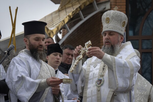 Metropolitan Epiphanius, the head of the Ukrainian Orthodox Church, blesses water during a traditional Epiphany celebration in Kyiv, Ukraine, Saturday, Jan. 6, 2024. Water that is blessed by a cleric on Epiphany is considered holy and pure until next year's celebration, and is believed to have special powers of protection and healing. (AP Photo/Efrem Lukatsky)