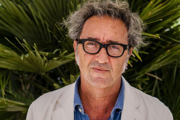Director Paolo Sorrentino poses for portraits at the 78th edition of the Venice Film Festival at the Venice Lido, Italy, Wednesday, Sept. 1, 2021, where he's presenting his latest movie 'E' stata la mano di Dio' (The hand of God). The festival opens on Sept. 1 through Sept. 11. (AP Photo/Domenico Stinellis)