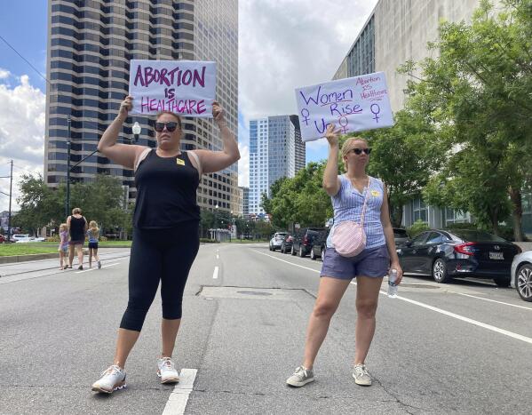 FILE - Protesters wave signs and demonstrate in support of abortion access in front of a New Orleans courthouse, July 8, 2022. Republican lawmakers in Louisiana rejected legislation Wednesday, May 10, 2023, that would add exceptions in cases of rape and incest to one of the strictest abortion bans in the country. (AP Photo/Rebecca Santana, File)