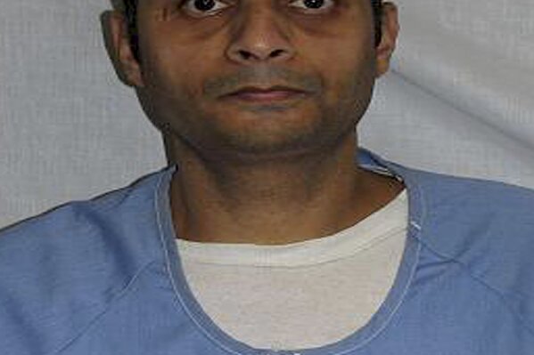 
              This undated photo released by the California Department of Corrections and Rehabilitation shows Virendra Govin. Govin is one of two men on California's death row for committing multiple murders that was found dead at San Quentin State Prison. California prison officials said Monday, Nov. 5, 2018, they are investigating both deaths as suicides. (California Department of Corrections and Rehabilitation via AP)
            