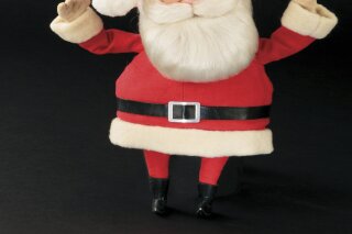 This image released by Profiles in History shows a Santa Claus puppet used in the filming of the 1964 Christmas special "Rudolph the Red-Nosed Reindeer." A buyer shouted out with glee that they would pay $368,000 for the Rudolph and Santa Claus figures used in the perennially beloved Christmas special “Rudolph the Red Nosed Reindeer.”  Bidding for the figures soared past the projected sale price of between $150,000 and $200,000 on Friday, Nov. 13, 2020 at the Icons & Legends of Hollywood Auction held in Los Angeles by Profiles in History. (Profiles in History via AP)