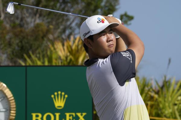 FILE - Tom Kim, of South Korea, watches his shot from the second tee during the second round of the Hero World Challenge at the Albany Golf Club in New Providence, Bahamas, Friday, Dec. 2, 2022. Kim starts the year with a new endorsement with Nike. (AP Photo/Fernando Llano, File)
