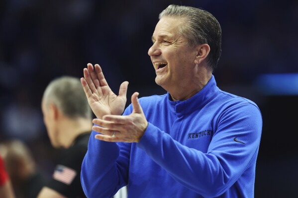 FILE - Kentucky head coach John Calipari applauds a made free-throw during the second half of an NCAA college basketball game against Louisville, Saturday, Dec. 31, 2022, in Lexington, Ky. Arkansas hired Calipari as their men’s basketball coach, Wednesday,April 10, 2024, one day after the Hall of Fame coach stepped down from the Kentucky program he led to the 2012 NCAA championship. (AP Photo/James Crisp, File_