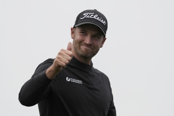 Wyndham Clark gestures after finishing the 18th hole at Pebble Beach Golf Links during the third round of the AT&T Pebble Beach National Pro-Am golf tournament in Pebble Beach, Calif., Saturday, Feb. 3, 2024. (AP Photo/Ryan Sun)