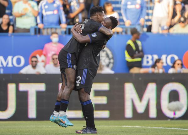 CF Montreal forward Romell Quioto, left, celebrates with Victor Wanyama after scoring against Charlotte FC during the first half of an MLS soccer match Saturday, June 25, 2022, in Montreal. (Graham Hughes/The Canadian Press via AP)