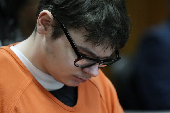 FILE - Ethan Crumbley sits in court listening to victim impact statements, Friday, Dec. 8, 2023, in Pontiac, Mich. A Michigan teen who was convicted of fatally shooting four students at his high school is appealing his life sentence, his attorneys announced Friday. (AP Photo/Carlos Osorio, Pool, file)