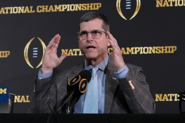 Michigan head coach Jim Harbaugh speaks during a news conference ahead of the national championship NCAA College Football Playoff game between Washington and Michigan Sunday, Jan. 7, 2024, in Houston. The game will be played Monday. (AP Photo/Godofredo A. Vasquez)