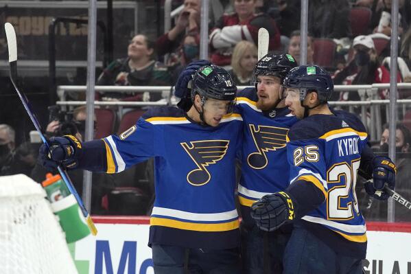 St. Louis Blues right wing Pavel Buchnevich (89) celebrates with center Brayden Schenn (10) and center Jordan Kyrou (25) after scoring a goal against the Arizona Coyotes in the first period of an NHL hockey game, Monday, Oct. 18, 2021, in Glendale, Ariz. (AP Photo/Rick Scuteri)