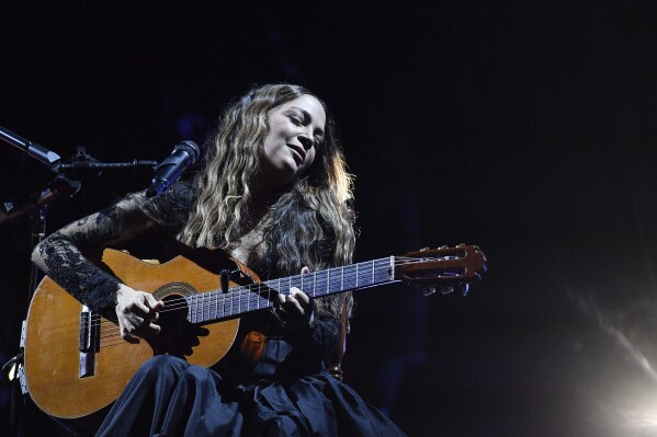 FILE - Mexican singer Natalia Lafourcade performs at the Concha Acustica of Bello Monte in Caracas, Venezuela on Aug. 22, 2023. (AP Photo/Matias Delacroix, File)