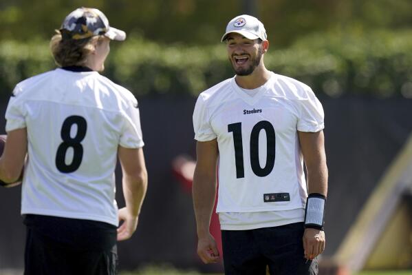Pittsburgh Steelers quarterback Mitch Trubisky, right, talks with Kenny Pickett during NFL football practice, Tuesday, Sept. 20, 2022, at UPMC Rooney Sports Complex in Pittsburgh. (Matt Freed/Pittsburgh Post-Gazette via AP)