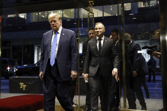 Republican presidential candidate former President Donald Trump walks with Poland's President Andrzej Duda at Trump Tower in midtown Manhattan in New York on Wednesday, April 17, 2024. (AP Photo/Stefan Jeremiah)