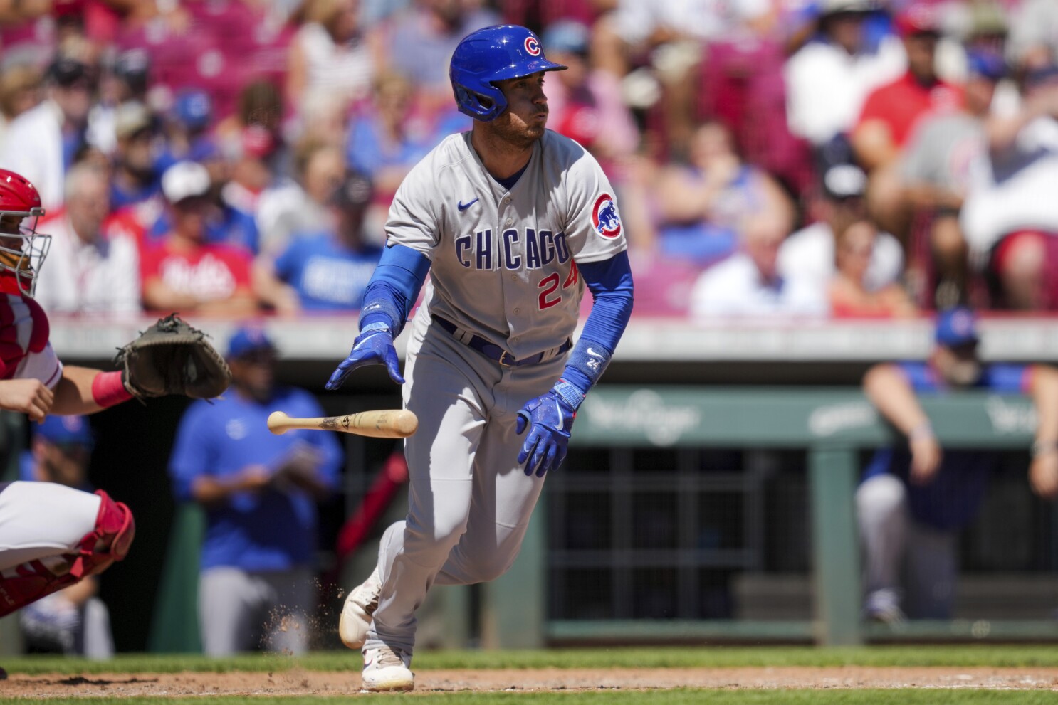 Reds use two three-run innings to beat Cubs