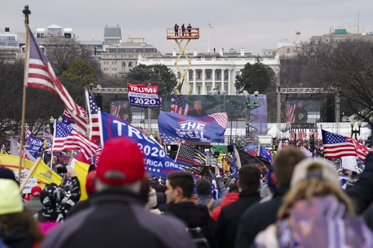 FILE - Trump supporters participate in a rally in Washington, Jan. 6, 2021, that some blame for fueling the attack on the U.S. Capitol. On Thursday, Feb. 8, the nation's highest court is scheduled to hear arguments in a case involving Section 3 of the 14th Amendment, which prohibits those who “engaged in insurrection or rebellion” from holding office. The case arises from a decision in Colorado, where that state's Supreme Court ruled that Trump violated Section 3 of the 14th Amendment and should be banned from ballot. (AP Photo/John Minchillo, File)