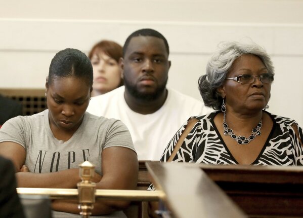 
              Audrey DuBose, right, mother of Sam DuBose, looks at the jury as Hamilton County Common Pleas Judge Leslie Ghiz declares a mistrial in the retrial of Ray Tensing Friday, June 23, 2017, in Cincinnati. Tensing, a former University of Cincinnati police officer, was charged with murdering Sam DuBose during a routine traffic stop on July 19, 2015.  Jurors deliberated more than 30 hours over five days. (Cara Owsley /The Cincinnati Enquirer via AP, Pool)
            