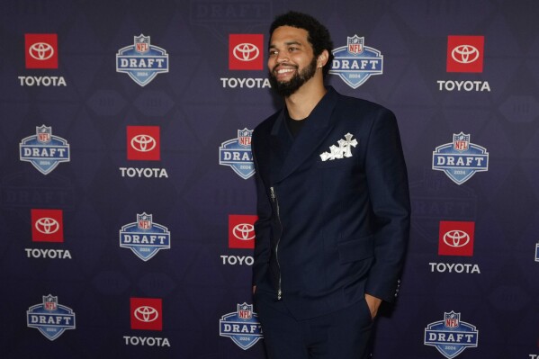 Southern California quarterback Caleb Williams poses on the red carpet ahead of the first round of the NFL football draft, Thursday, April 25, 2024, in Detroit. (AP Photo/Carlos Osorio)