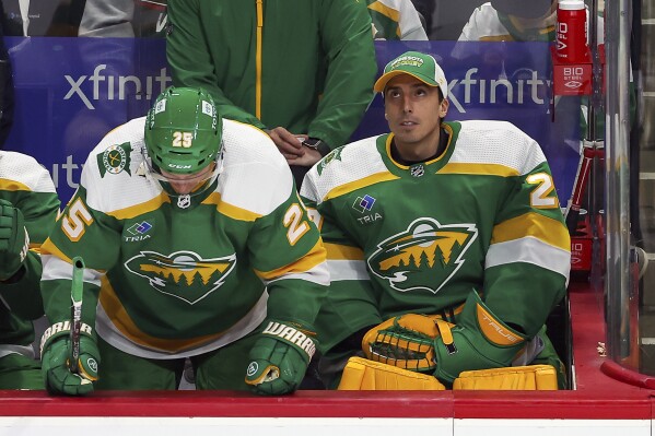 Minnesota Wild goaltender Marc-Andre Fleury (29) looks on from the bench during the third period of an NHL hockey game against the Colorado Avalanche, Friday, Nov. 24, 2023, in St. Paul, Minn. (AP Photo/Matt Krohn)