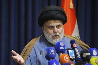 FILE - Populist Shiite cleric Muqtada al-Sadr, speaks during a press conference in Najaf, Iraq, Nov. 18, 2021. Iraqi lawmakers failed to elect a new head of state Monday, Feb. 7, 2022, as key factions, many of them allied with al-Sadr, foiled the attempt by boycotting the parliament session. Only 58 lawmakers of the legislature’s 329 members showed up. (AP Photo/Anmar Khalil, File)