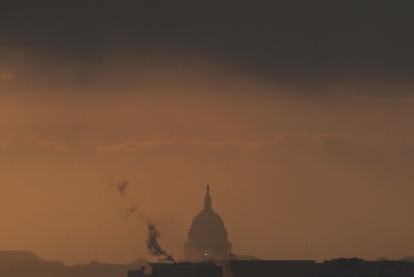 The U.S. Capitol is seen from Arlington National Cemetery at sunrise, Thursday, May 15, 2025, in Arlington, Va. (AP Photo/Julia Demaree Nikhinson)