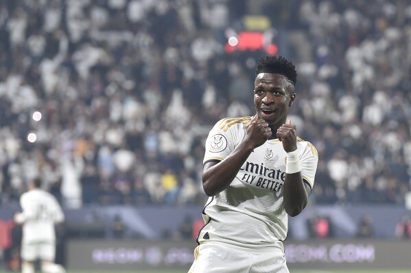 Real Madrid's Vinicius Junior celebrates after scoring at Barcelona during the Spanish Super Cup final soccer match between Real Madrid and Barcelona at Al Awwal Park Stadium in Riyadh, Saudi Arabia, Sunday, Jan. 14, 2024. (AP Photo)