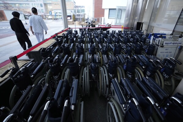 Wheelchairs are placed at Seoul National University Hospital in Seoul, South Korea, Tuesday, Feb. 20, 2024. South Korean trainee doctors collectively walked off their jobs Tuesday to escalate their protest of a government medical policy, triggering cancellations of surgeries and other medical treatments at hospitals. (AP Photo/Ahn Young-joon)