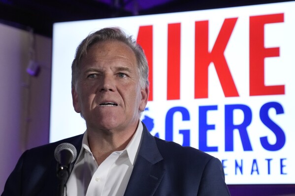 Former U.S. Rep. and Republican candidate for Michigan Senate Mike Rogers talks to supporters at a post election gathering, Tuesday, Aug. 6, 2024, in Lake Orion, Mich. (AP Photo/Carlos Osorio)