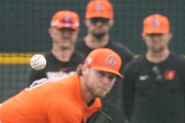 Baltimore Orioles pitcher Corbin Burnes throws during live batting practice at spring training in Sarasota, Fla., Saturday, Feb. 17, 2024. (AP Photo/Gerald Herbert)