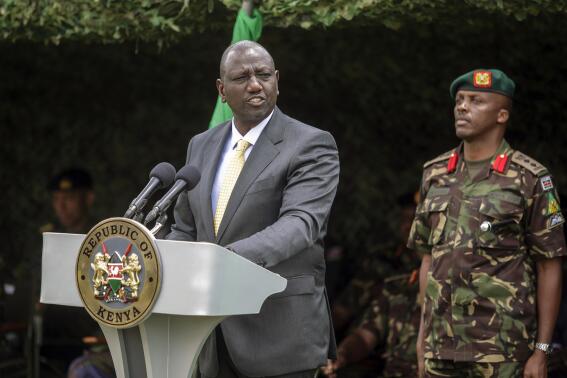 Kenya's President William Ruto speaks at a flag-handover ceremony for members from the Kenya Defence Forces (KDF), ahead of their future deployment to eastern Congo as part of the newly-created East African Community Regional Force (EACRF), at the Embakasi garrison in Nairobi, Kenya Wednesday, Nov. 2, 2022. Kenya is sending more than 900 military personnel to eastern Congo to join a new regional force trying to calm deadly tensions fueled by armed groups that have led to a diplomatic crisis between Congo and neighboring Rwanda. (AP Photo/Brian Inganga)