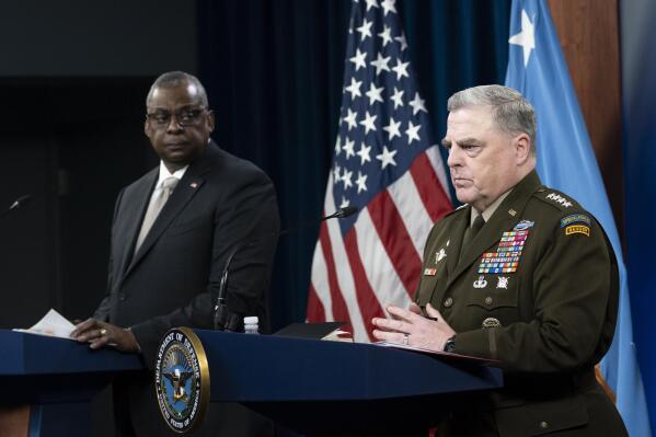 Secretary of Defense Lloyd Austin, left, and Joint Chiefs Chairman Gen. Mark Milley, speak with reporters after a virtual meeting of the Ukraine Defense Contact Group at the Pentagon, Monday, May 23, 2022, in Washington. (AP Photo/Alex Brandon)