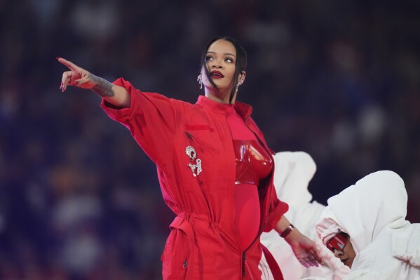 FILE - Rihanna reveals her baby bump as she performs during the halftime show at the NFL Super Bowl 57 football game between the Kansas City Chiefs and the Philadelphia Eagles on Feb. 12, 2023, in Glendale, Ariz. (AP Photo/Ross D. Franklin, File)