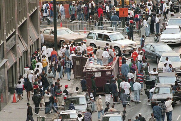FILE - Crowds of people jam Marietta Street for Freaknik near the intersection of Peachtree Street in Atlanta on April 19, 1996. A new Hulu documentary “Freaknik: The Wildest Story Never Told,” touches on how the event started as an innocent Black College cookout that ultimately drew thousands from across the United States. (Philip McCollum/Atlanta Journal-Constitution via AP, File)