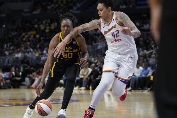 Phoenix Mercury center Brittney Griner (42) fouls Los Angeles Sparks forward Nneka Ogwumike (30) during the first half of a WNBA basketball game in Los Angeles, Friday, May 19, 2023. (AP Photo/Ashley Landis)