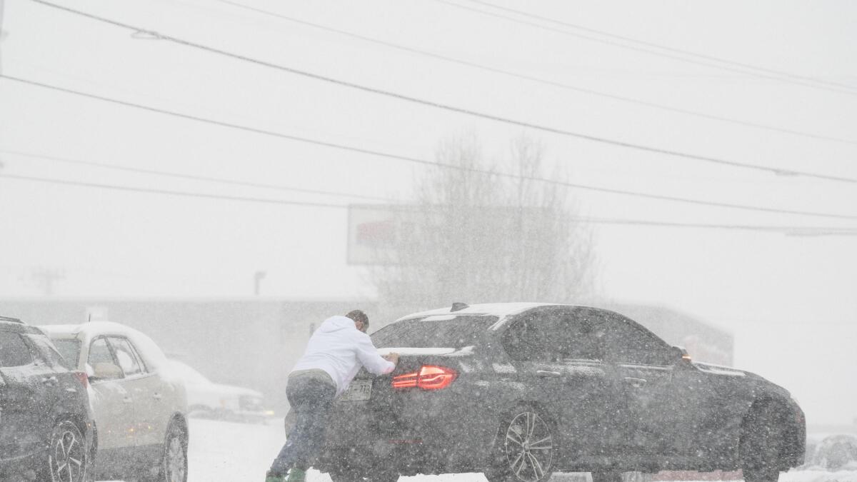 Winter storm blanketing parts of South with snow, ice | AP News
