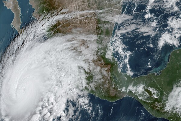 This satellite image provided by NOAA on Thursday, Oct. 19, 2023, shows Hurricane Storm Norma approaching the southern tip of the Baja California peninsula on Mexico's Pacific coast. (NOAA via AP)
