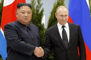FILE - Russian President Vladimir Putin, right, and North Korea's leader Kim Jong Un shake hands during their meeting in Vladivostok, Russia, April 25, 2019. North Korea says it has not exported any weapons to Russia during the war in Ukraine and has no plans to do so, and said U.S. intelligence reports of weapons transfers were an attempt to tarnish North Korea's image. (AP Photo/Alexander Zemlianichenko, Pool, File)