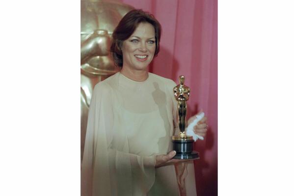 FILE - Louise Fletcher holds the Academy Award she won for her leading role in "One Flew Over The Cuckoo's Nest" in Los Angeles, March 30, 1976. Fletcher, a late-blooming star whose riveting performance as the cruel and calculating Nurse Ratched in "One Flew Over the Cuckoo's Nest" set a new standard for screen villains and won her an Academy Award, died Friday, Sept. 23, 2022, at age 88. (AP Photo/File)