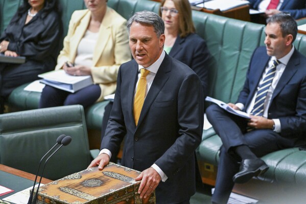 Australian Defense Minister Richard Marles speaks during Question Time in the House of Representatives at Parliament House in Canberra, Wednesday, Sept. 6, 2023. The Australian government proposed Thursday, Sept. 14, tougher restrictions on former defense military personnel who want to train foreign militaries as the nation prepares to share nuclear secrets with the United States and Britain. (Lukas Coch/AAP Image via AP)