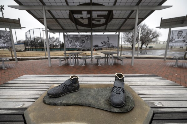 A bronze statue of legendary baseball pioneer Jackie Robinson was stolen from a park in Wichita, Kan., during the early morning hours of Thursday, Jan. 25, 2024. The statue, valued at $75,000, was the centerpiece of the League 42 ballpark facility, a baseball league started in 2015 to help kids with little access to organized sports. The league currently has 600 kids signed up to play this spring. Wichita police said during a Friday news conference that they are working desperately to catch the thieves. (Travis Heying/The Wichita Eagle via AP)